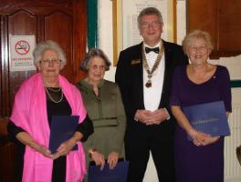 President Ashley with Jane Rowsell,Peggy Ward and Vera Burbridge with their  Paul Harris Fellowship Awards